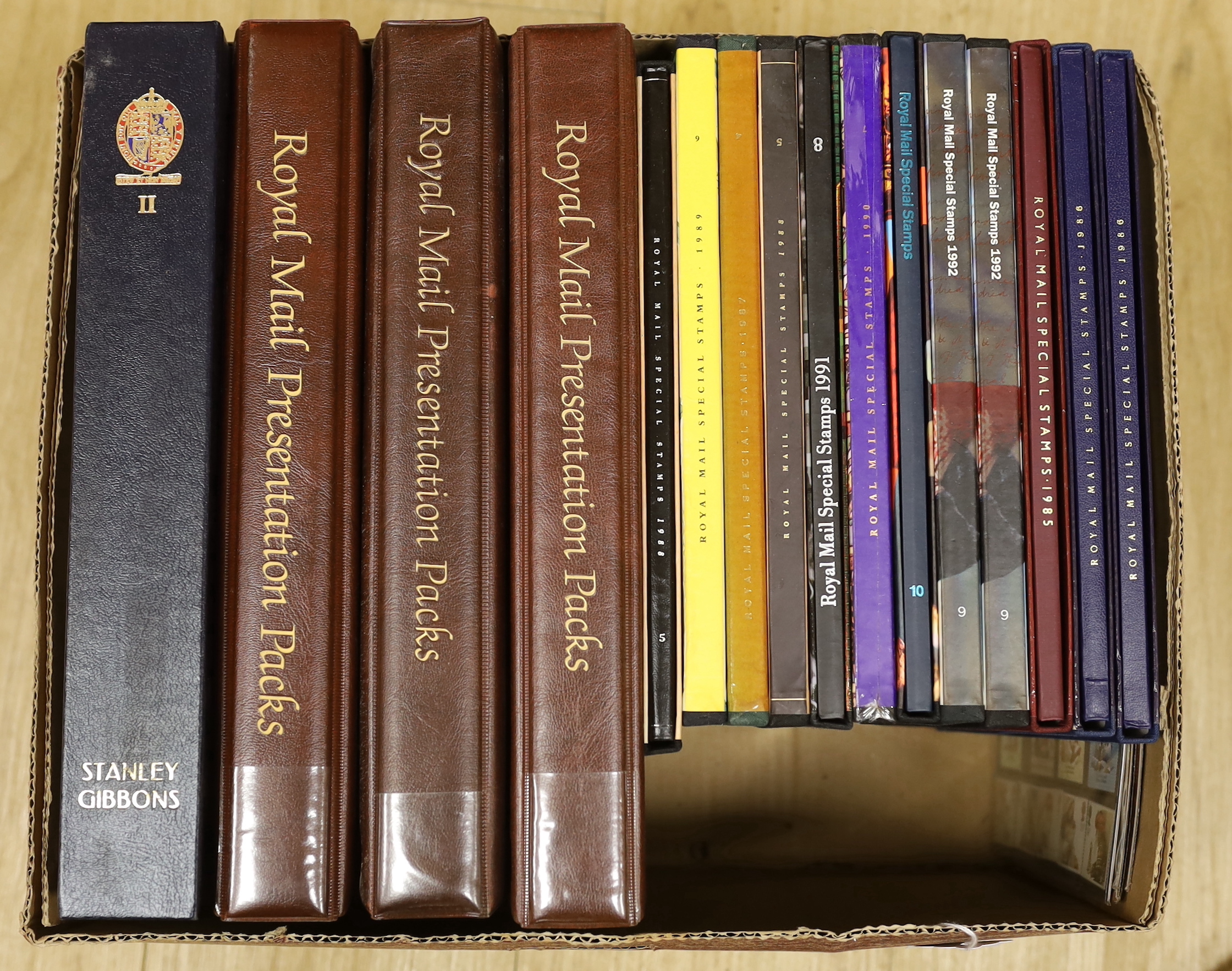 Royal Mail GB stamps - commemorative presentation packs in three albums, GB stamp album 1988-1991, twelve special stamps issues 1985-1991 (some duplicates) and five collector’s packs (one box)